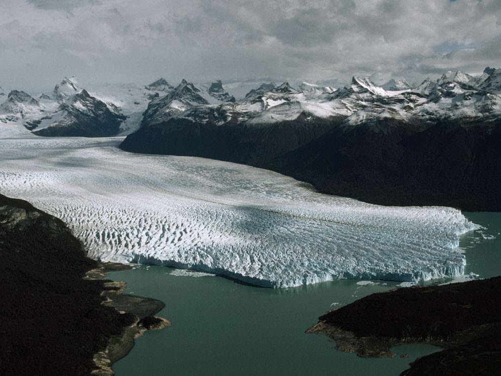 Glaciers are large bodies of frozen water that carve out the landscape as they move towards the ocean