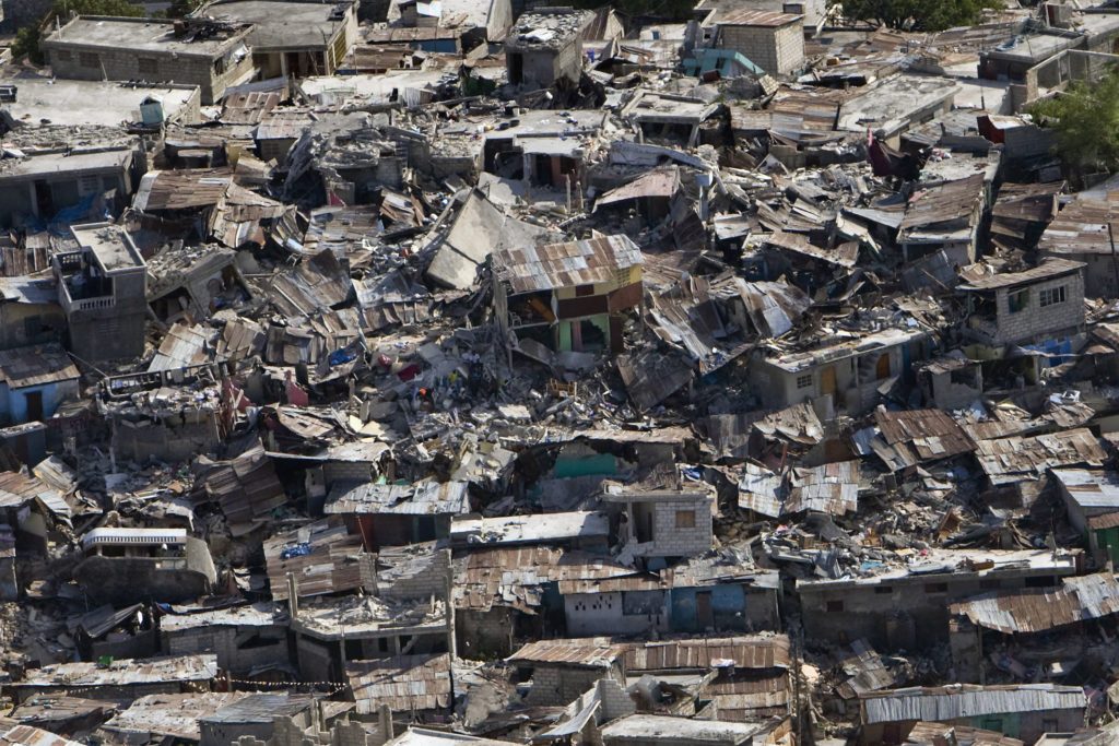 Hazards of earthquakes include damaged buildings, such as in this densely populated area.